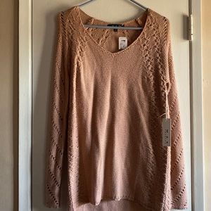 New, unused sweater with tags.
